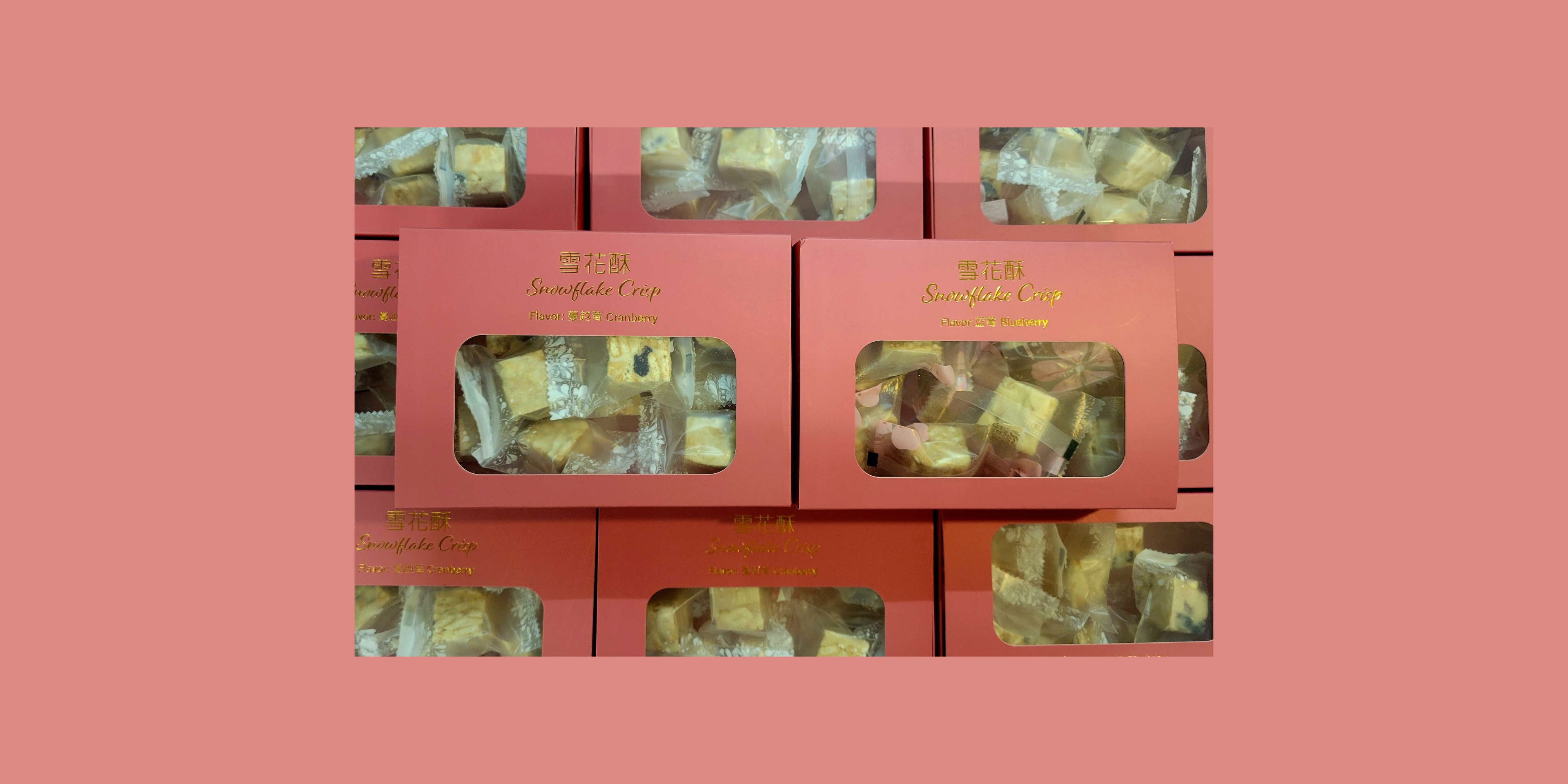 Snowflake Crisp dessert boxes in cranberry and blueberry flavors, featuring handmade no-bake treats with visible crackers and dried fruit.