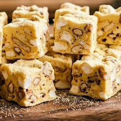 Handmade snowflake crisps with marshmallow, crackers, and nuts — cozy no-bake dessert